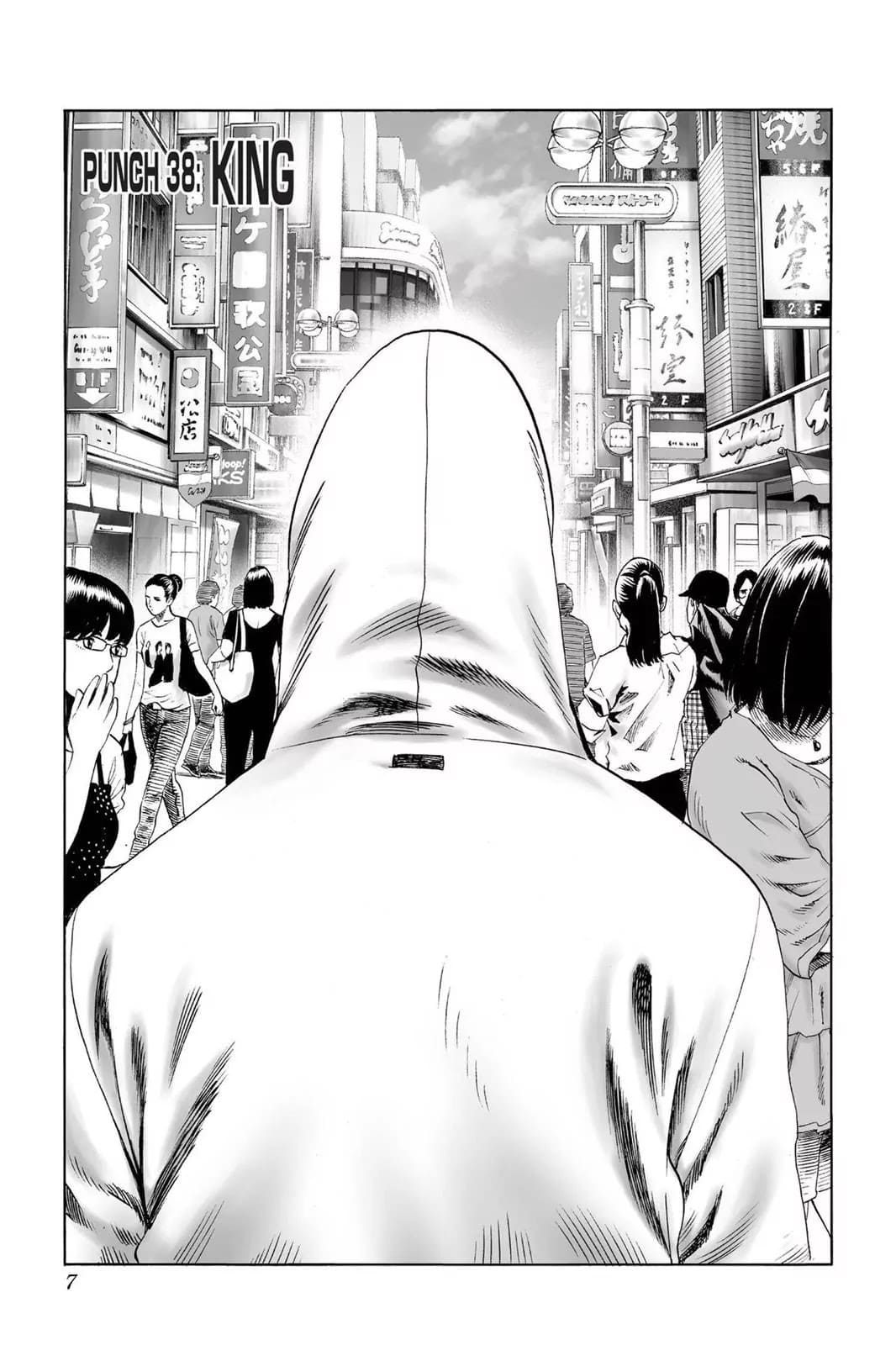 A hooded man walks in the middle of the crowd.