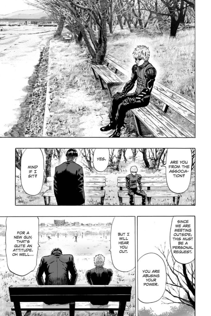 Genos sits down on a park bench while a person from the association approaches him with a personal request.