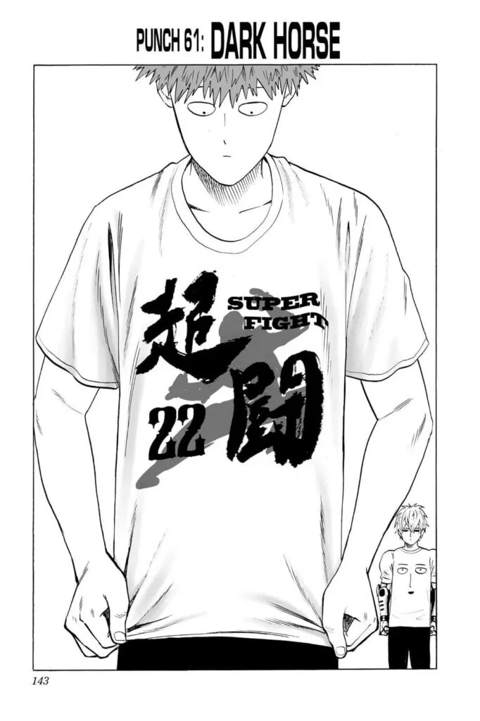 Saitama is wearing a t-shirt with the words Super Fight 22 while Genos stands behind him, also wearing a shirt with Saitama's face.